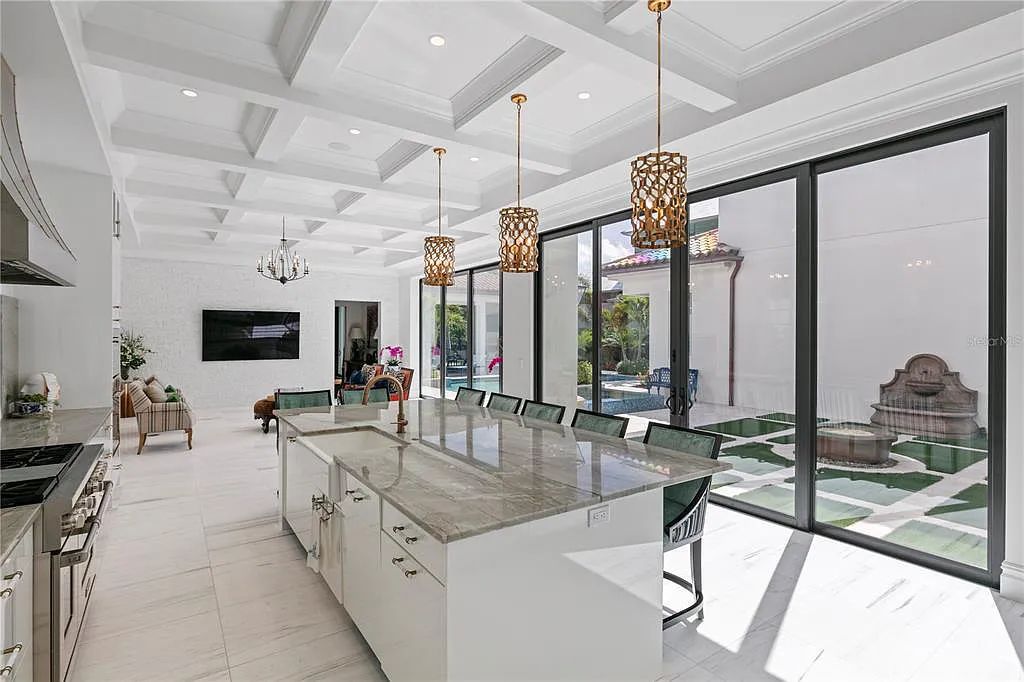 The Home in Orlando, a Spanish style residence nestled within the private residential community of Golden Oak with resort features including an expansive chef’s kitchen, Four Seasons catering kitchen, elevator, 3-car garage and two flex rooms is now available for sale. This home located at 10285 Summer Meadow Way, Orlando, Florida