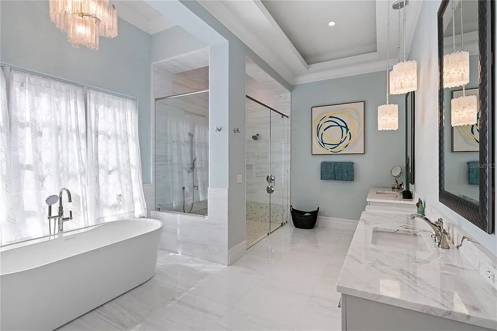 The Home in Orlando, a Spanish style residence nestled within the private residential community of Golden Oak with resort features including an expansive chef’s kitchen, Four Seasons catering kitchen, elevator, 3-car garage and two flex rooms is now available for sale. This home located at 10285 Summer Meadow Way, Orlando, Florida