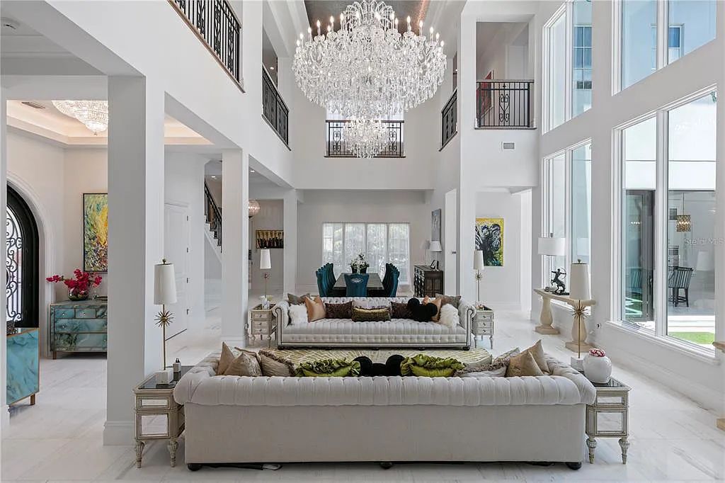 The Home in Orlando, a Spanish style residence nestled within the private residential community of Golden Oak with resort features including an expansive chef’s kitchen, Four Seasons catering kitchen, elevator, 3-car garage and two flex rooms is now available for sale. This home located at 10285 Summer Meadow Way, Orlando, Florida
