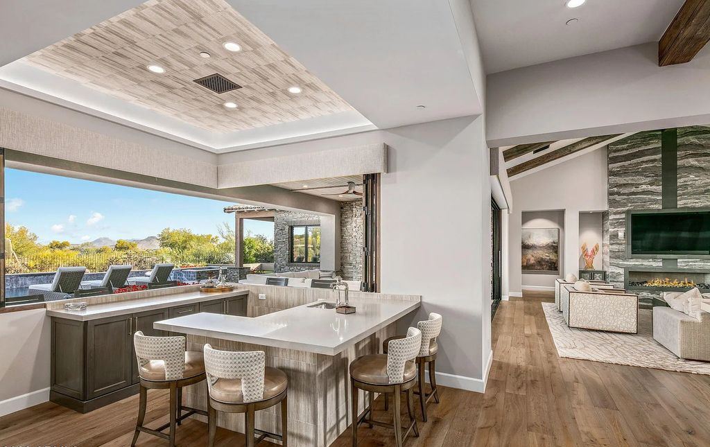 The Home in Scottsdale, a nearly brand new modern farmhouse was upgraded both inside and out set on the beautiful 10th fairway of the award winning Mirabel Club community's Tom Fazio designed golf course is now available for sale. This home located at 36931 N 102nd Pl, Scottsdale, Arizona