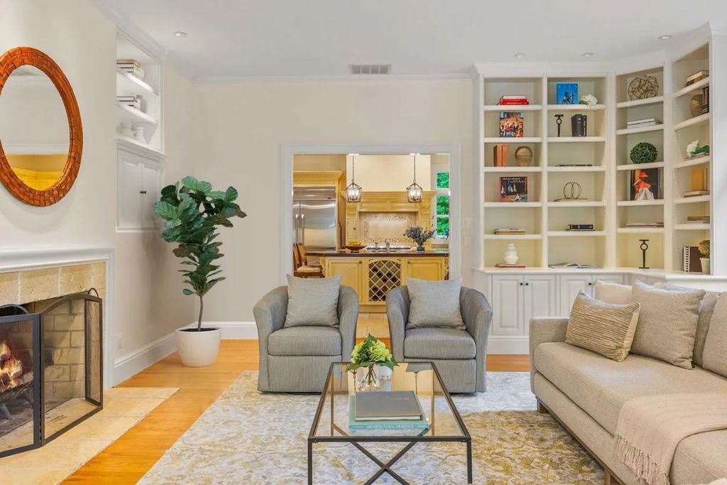 The Home in Bethesda features a private balcony seemingly floating in the woods, while an oversized walk-in closet and spa-inspired bath with separate vanities, now available for sale. This home located at 8814 Chalon Dr, Bethesda, Maryland