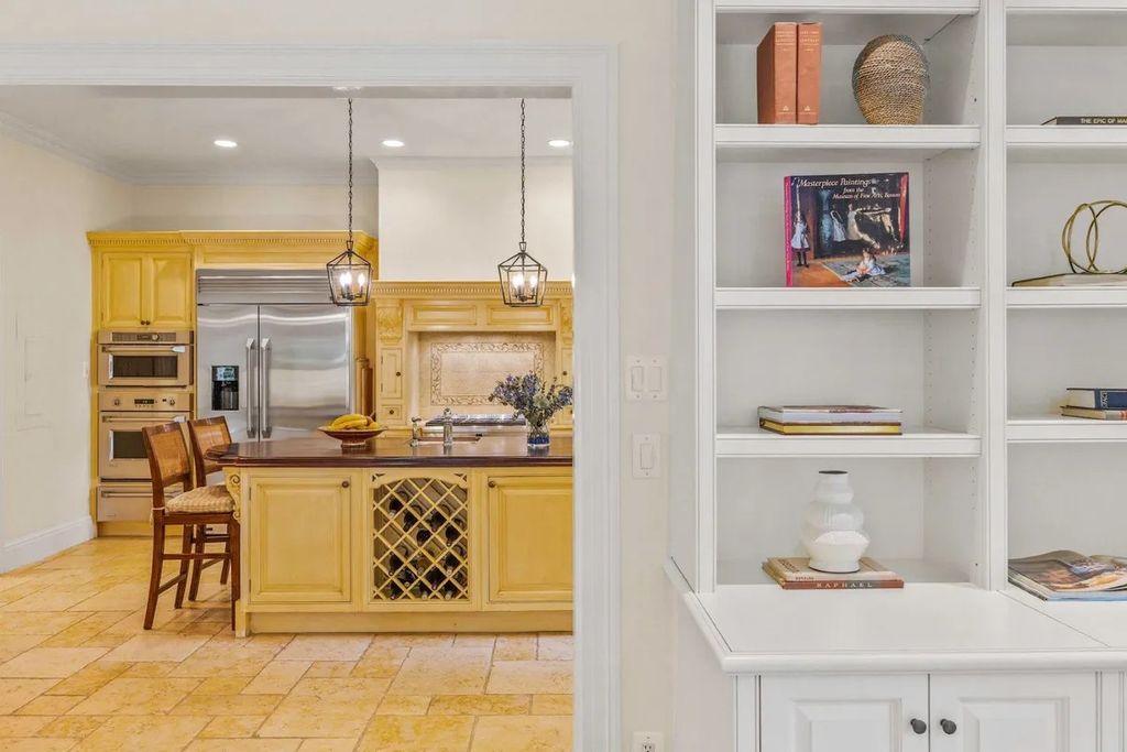 The Home in Bethesda features a private balcony seemingly floating in the woods, while an oversized walk-in closet and spa-inspired bath with separate vanities, now available for sale. This home located at 8814 Chalon Dr, Bethesda, Maryland