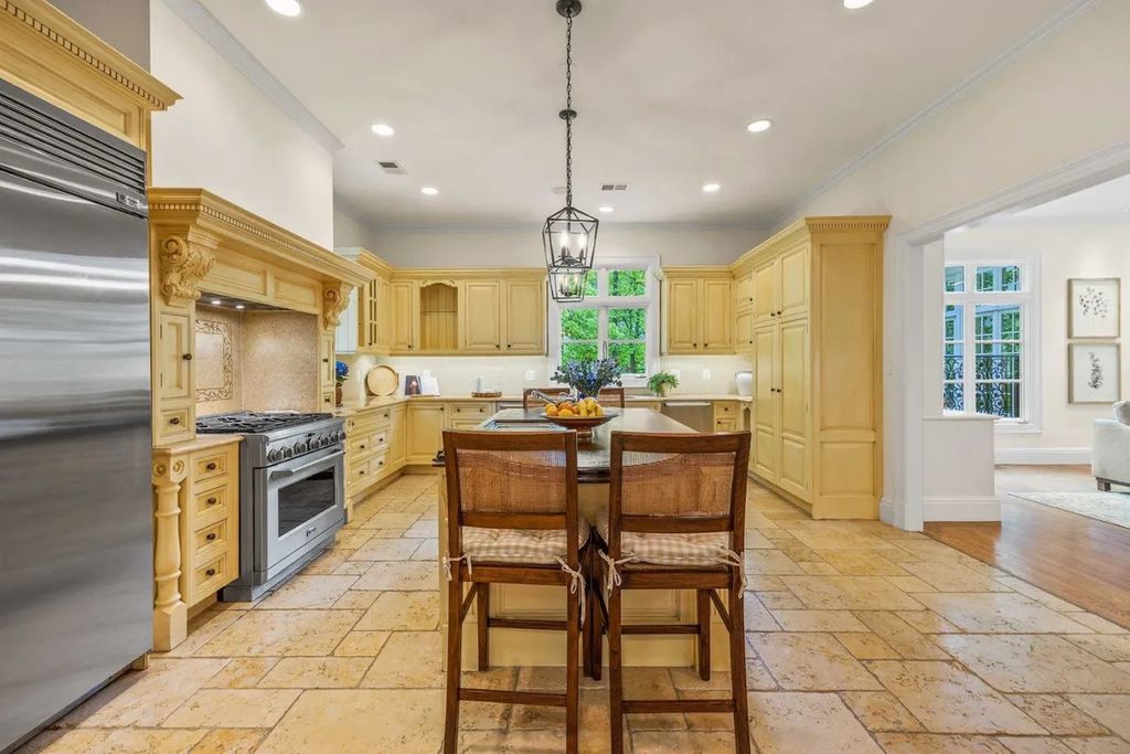 The Home in Bethesda features a private balcony seemingly floating in the woods, while an oversized walk-in closet and spa-inspired bath with separate vanities, now available for sale. This home located at 8814 Chalon Dr, Bethesda, Maryland