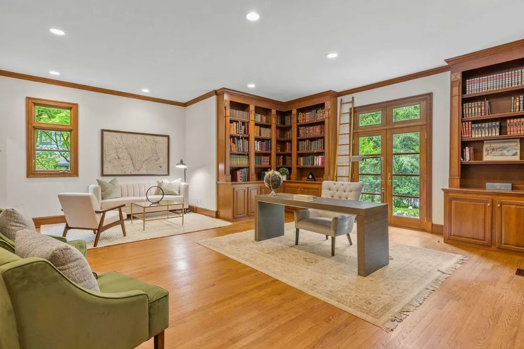The Home in Bethesda features a private balcony seemingly floating in the woods, while an oversized walk-in closet and spa-inspired bath with separate vanities, now available for sale. This home located at 8814 Chalon Dr, Bethesda, Maryland