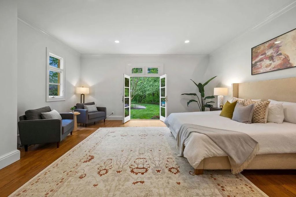 The Home in Bethesda features a private balcony seemingly floating in the woods, while an oversized walk-in closet and spa-inspired bath with separate vanities, now available for sale. This home located at 8814 Chalon Dr, Bethesda, Maryland