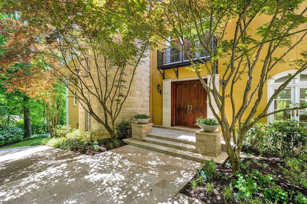 The Home in Bethesda features a private balcony seemingly floating in the woods, while an oversized walk-in closet and spa-inspired bath with separate vanities, now available for sale. This home located at 8814 Chalon Dr, Bethesda, Maryland