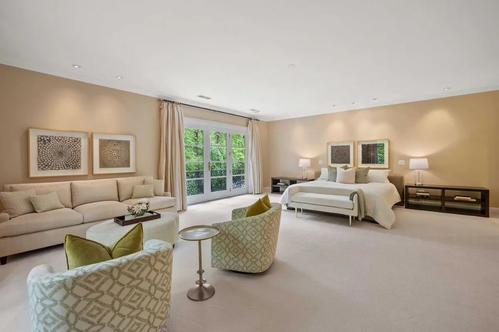 The Home in Bethesda features a private balcony seemingly floating in the woods, while an oversized walk-in closet and spa-inspired bath with separate vanities, now available for sale. This home located at 8814 Chalon Dr, Bethesda, Maryland