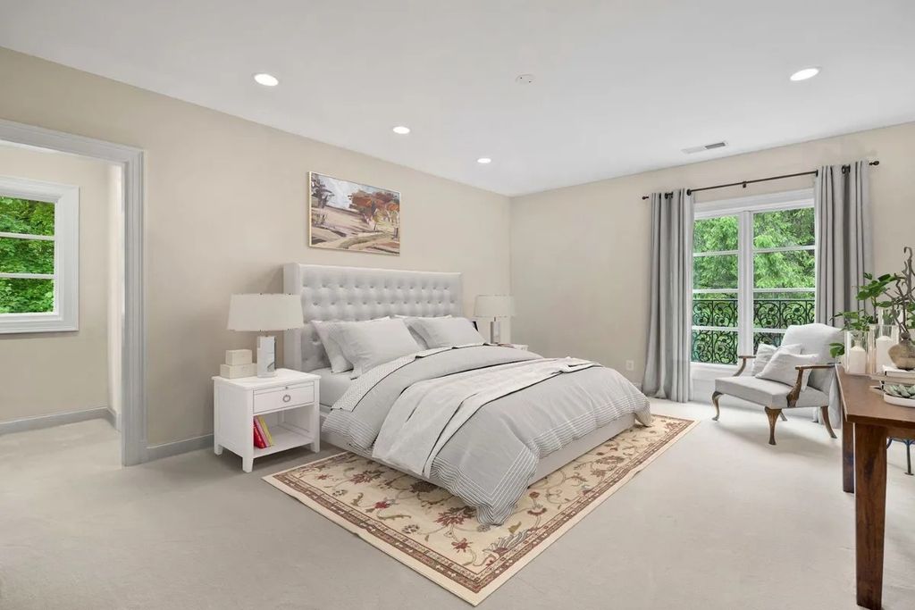 The Home in Bethesda features a private balcony seemingly floating in the woods, while an oversized walk-in closet and spa-inspired bath with separate vanities, now available for sale. This home located at 8814 Chalon Dr, Bethesda, Maryland