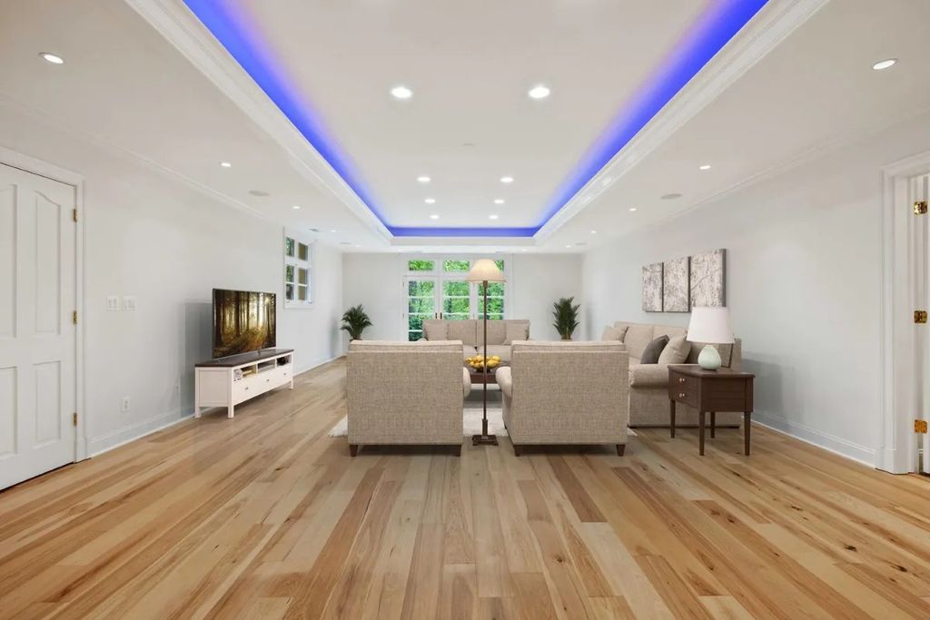The Home in Bethesda features a private balcony seemingly floating in the woods, while an oversized walk-in closet and spa-inspired bath with separate vanities, now available for sale. This home located at 8814 Chalon Dr, Bethesda, Maryland