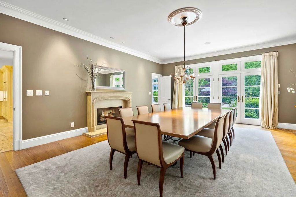 The Home in Bethesda features a private balcony seemingly floating in the woods, while an oversized walk-in closet and spa-inspired bath with separate vanities, now available for sale. This home located at 8814 Chalon Dr, Bethesda, Maryland