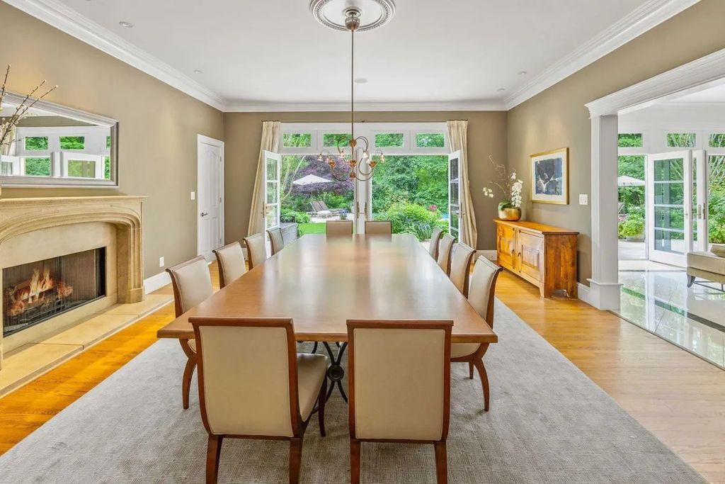 The Home in Bethesda features a private balcony seemingly floating in the woods, while an oversized walk-in closet and spa-inspired bath with separate vanities, now available for sale. This home located at 8814 Chalon Dr, Bethesda, Maryland