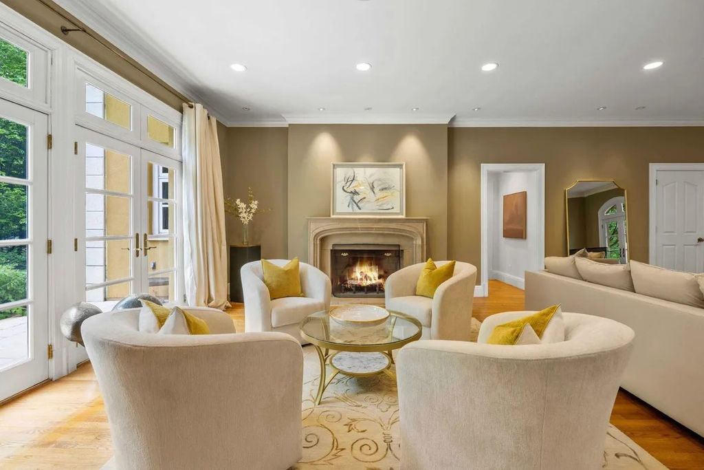 The Home in Bethesda features a private balcony seemingly floating in the woods, while an oversized walk-in closet and spa-inspired bath with separate vanities, now available for sale. This home located at 8814 Chalon Dr, Bethesda, Maryland