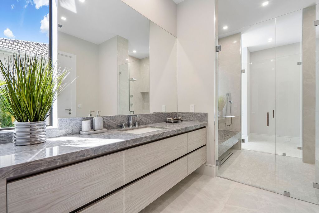 The Home in Boca Raton, a brand new modern estate in the world-renowned St. Andrew CC was designed by George Brewer Architect and decorated by Zelman Design is now available for sale. This home located at 17192 Northway Cir, Boca Raton, Florida