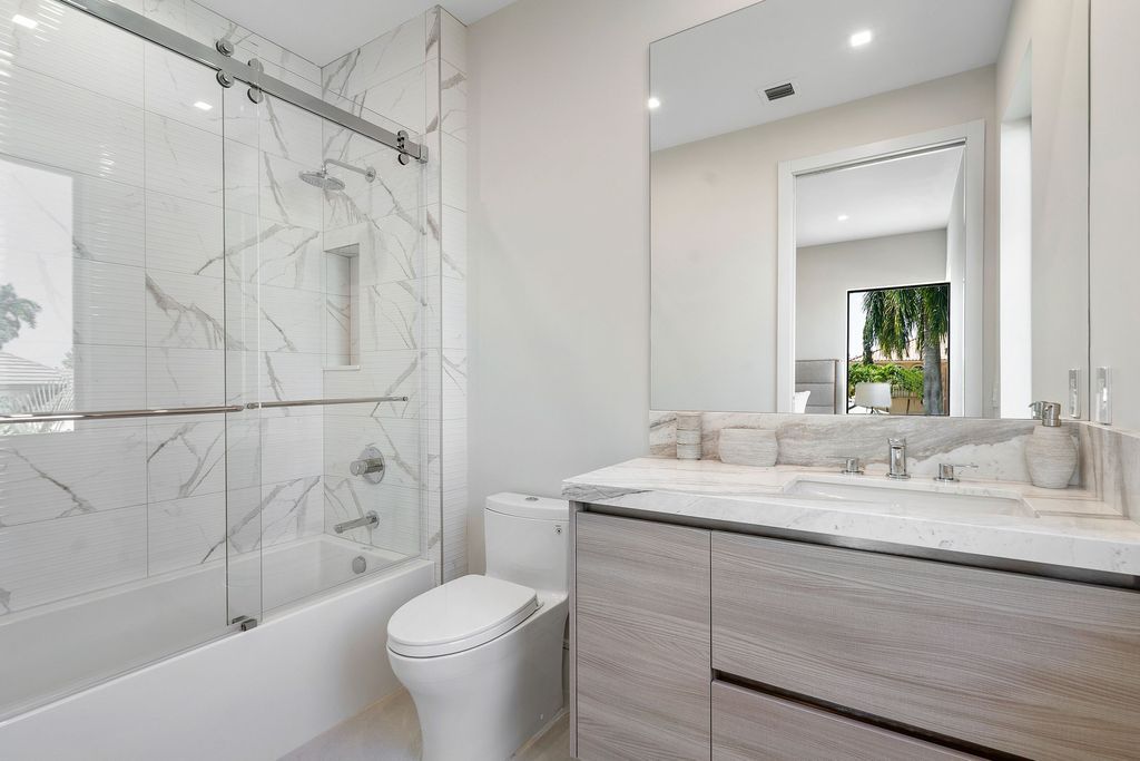 The Home in Boca Raton, a brand new modern estate in the world-renowned St. Andrew CC was designed by George Brewer Architect and decorated by Zelman Design is now available for sale. This home located at 17192 Northway Cir, Boca Raton, Florida