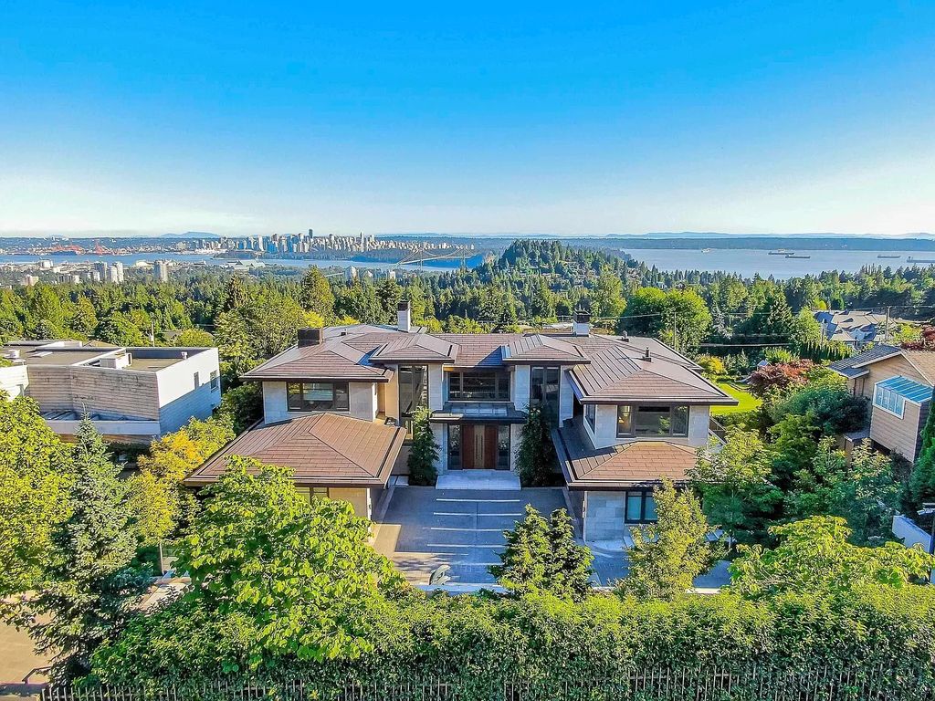 The Estate in West Vancouver is a luxurious home projecting architectural elegance and grandeur with classic modern design and rich materials now available for sale. This home located at 730 Fairmile Rd, West Vancouver, BC V7S 1R2, Canada; offering 08 bedrooms and 11 bathrooms with 14,759 square feet of living spaces.