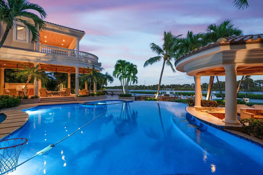 The Estate in Jupiter, an intracoastal masterpiece in The Club of Admirals Cove was executed by the talents of the design team of Affiniti Architechts, Parker-Yannette Landscape, Decorators Unlimited and Turtle Beach Construction is now available for sale. This home located at 192 Spyglass Ct, Jupiter, Florida