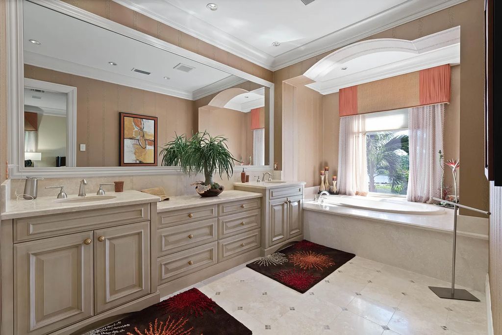 The Estate in Jupiter, an intracoastal masterpiece in The Club of Admirals Cove was executed by the talents of the design team of Affiniti Architechts, Parker-Yannette Landscape, Decorators Unlimited and Turtle Beach Construction is now available for sale. This home located at 192 Spyglass Ct, Jupiter, Florida