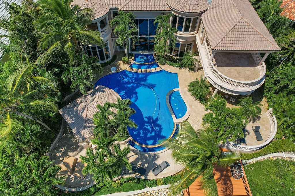 The Estate in Jupiter, an intracoastal masterpiece in The Club of Admirals Cove was executed by the talents of the design team of Affiniti Architechts, Parker-Yannette Landscape, Decorators Unlimited and Turtle Beach Construction is now available for sale. This home located at 192 Spyglass Ct, Jupiter, Florida