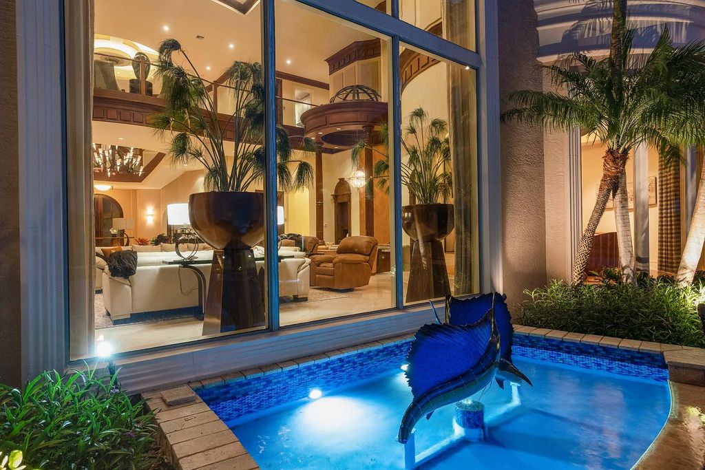 The Estate in Jupiter, an intracoastal masterpiece in The Club of Admirals Cove was executed by the talents of the design team of Affiniti Architechts, Parker-Yannette Landscape, Decorators Unlimited and Turtle Beach Construction is now available for sale. This home located at 192 Spyglass Ct, Jupiter, Florida