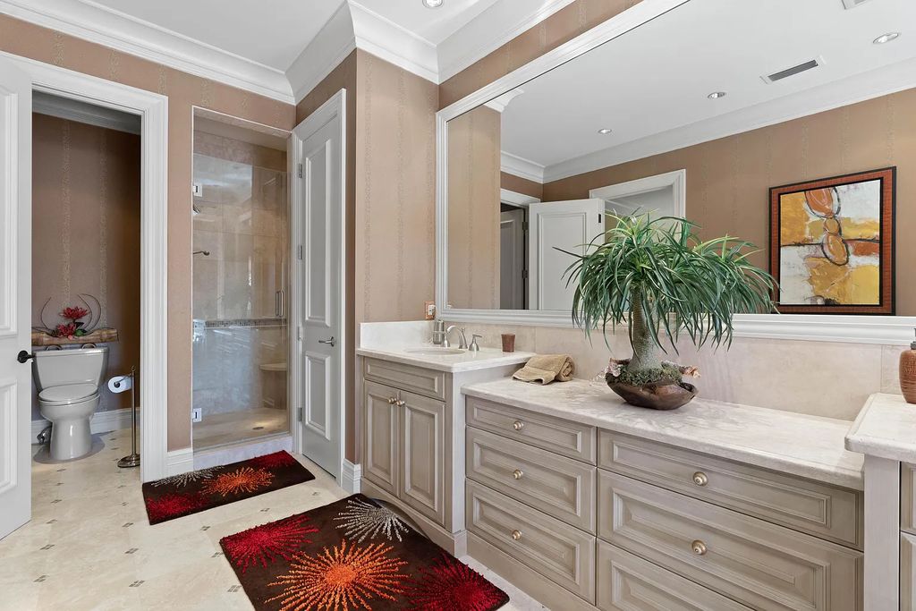 The Estate in Jupiter, an intracoastal masterpiece in The Club of Admirals Cove was executed by the talents of the design team of Affiniti Architechts, Parker-Yannette Landscape, Decorators Unlimited and Turtle Beach Construction is now available for sale. This home located at 192 Spyglass Ct, Jupiter, Florida