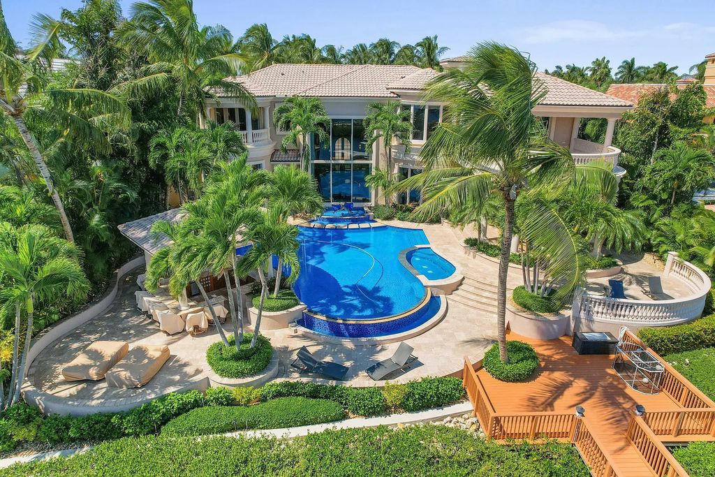 The Estate in Jupiter, an intracoastal masterpiece in The Club of Admirals Cove was executed by the talents of the design team of Affiniti Architechts, Parker-Yannette Landscape, Decorators Unlimited and Turtle Beach Construction is now available for sale. This home located at 192 Spyglass Ct, Jupiter, Florida