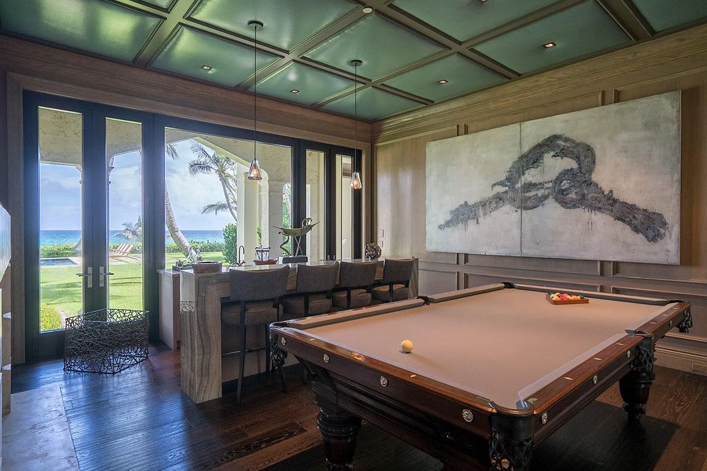 The Mansion in Highland Beach, a trophy property delivers over 150 feet of private manicured beachfront  on nearly 2 acres featuring modern French-Eclectic architecture, transitional interiors is now available for sale. This home located at 2455 S Ocean Blvd, Highland Beach, Florida