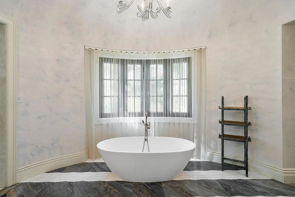 The Mansion in Highland Beach, a trophy property delivers over 150 feet of private manicured beachfront  on nearly 2 acres featuring modern French-Eclectic architecture, transitional interiors is now available for sale. This home located at 2455 S Ocean Blvd, Highland Beach, Florida