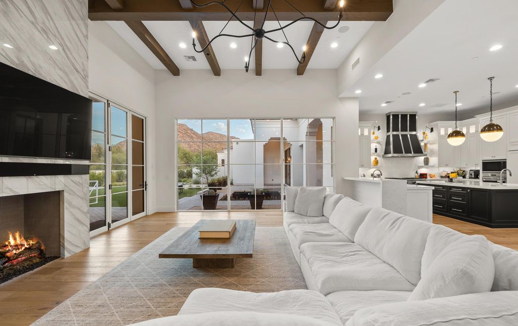8311 N 53rd Street, Paradise Valley, Arizona is a transitional Mediterranean estate with amazing Mummy mountain views and tons of privacy showcases the pinnacle of resort style living. 