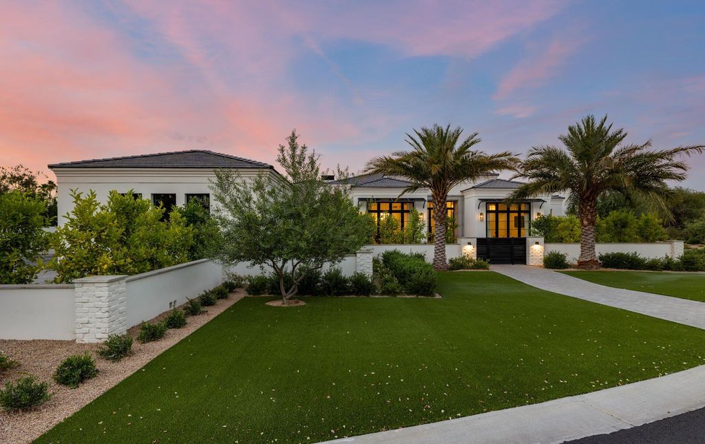 8311 N 53rd Street, Paradise Valley, Arizona is a transitional Mediterranean estate with amazing Mummy mountain views and tons of privacy showcases the pinnacle of resort style living. 