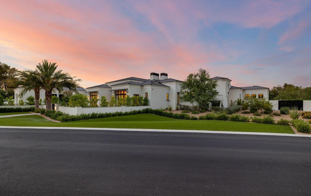 8311 N 53rd Street, Paradise Valley, Arizona is a transitional Mediterranean estate with amazing Mummy mountain views and tons of privacy showcases the pinnacle of resort style living. 