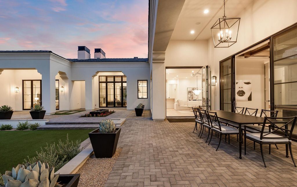 8311 N 53rd Street, Paradise Valley, Arizona is a transitional Mediterranean estate with amazing Mummy mountain views and tons of privacy showcases the pinnacle of resort style living. 