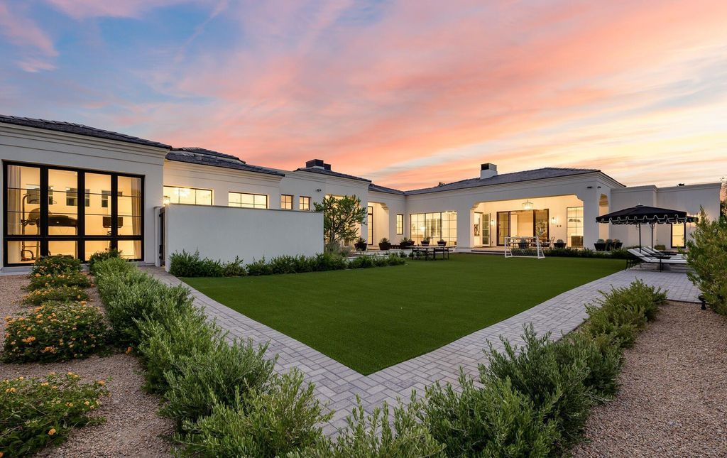 8311 N 53rd Street, Paradise Valley, Arizona is a transitional Mediterranean estate with amazing Mummy mountain views and tons of privacy showcases the pinnacle of resort style living. 