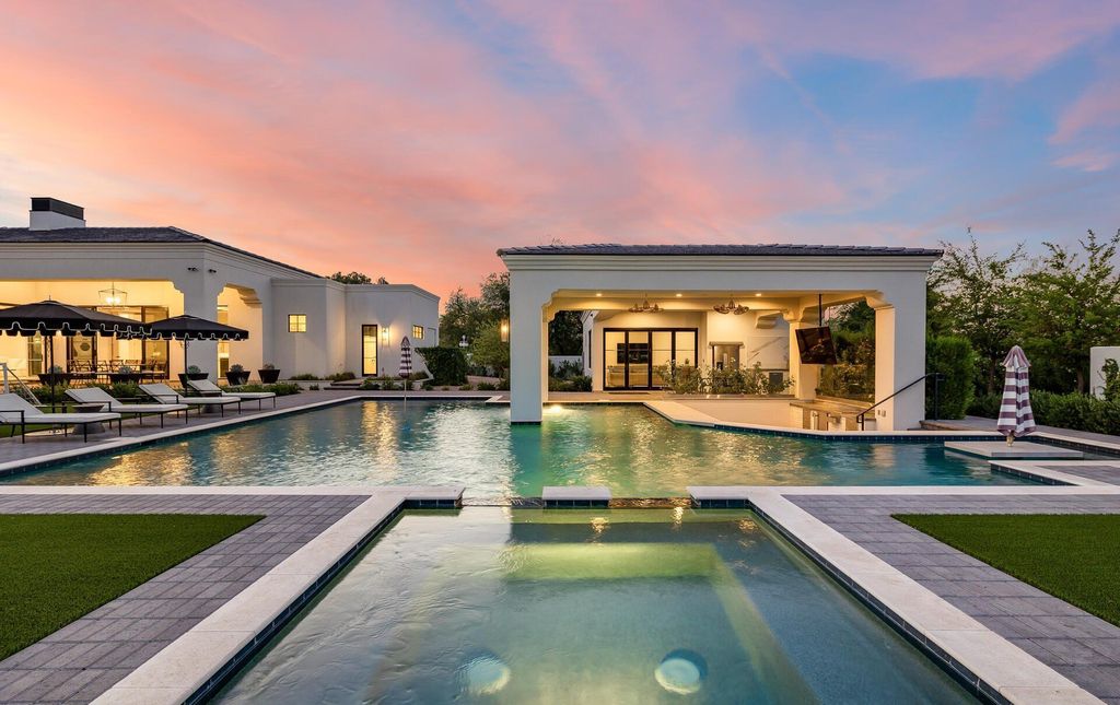 8311 N 53rd Street, Paradise Valley, Arizona is a transitional Mediterranean estate with amazing Mummy mountain views and tons of privacy showcases the pinnacle of resort style living. 