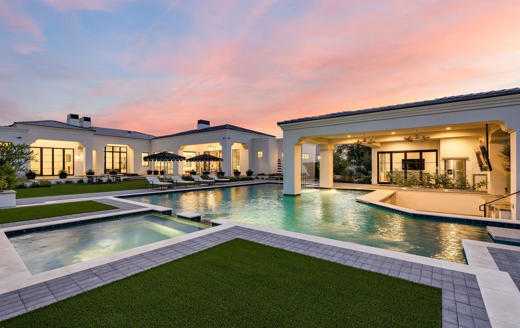 8311 N 53rd Street, Paradise Valley, Arizona is a transitional Mediterranean estate with amazing Mummy mountain views and tons of privacy showcases the pinnacle of resort style living. 