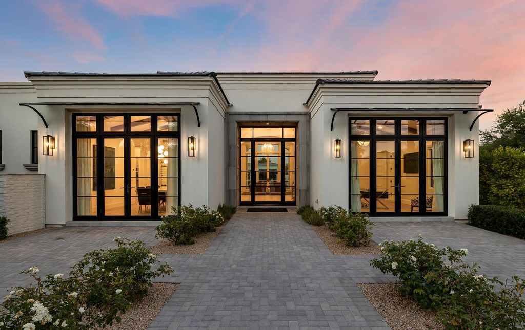 8311 N 53rd Street, Paradise Valley, Arizona is a transitional Mediterranean estate with amazing Mummy mountain views and tons of privacy showcases the pinnacle of resort style living. 