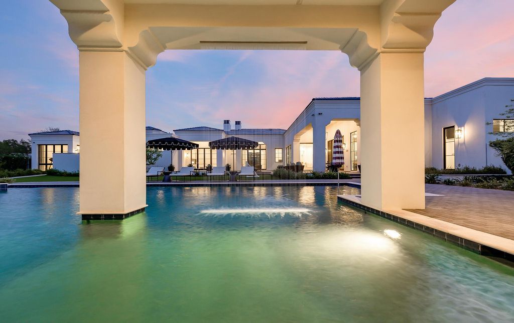 8311 N 53rd Street, Paradise Valley, Arizona is a transitional Mediterranean estate with amazing Mummy mountain views and tons of privacy showcases the pinnacle of resort style living. 