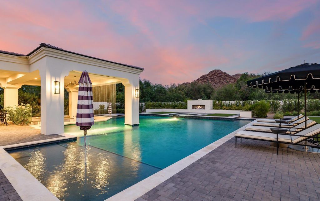 8311 N 53rd Street, Paradise Valley, Arizona is a transitional Mediterranean estate with amazing Mummy mountain views and tons of privacy showcases the pinnacle of resort style living. 