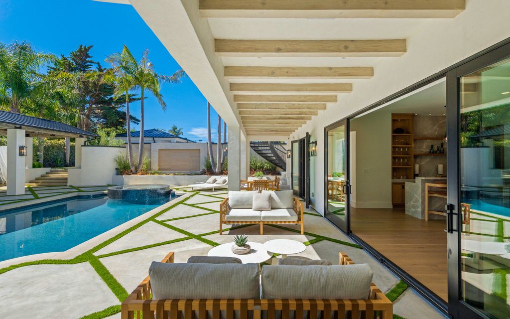 The Home in Malibu, a majestic estate Bbuilt on a palatial scale, with soaring ceilings, stunning woodwork, and bespoke fixtures, the residence has been entirely remodeled inside and out with impeccable attention to detail is now available for sale. This home located at 7052 Dume Dr, Malibu, California