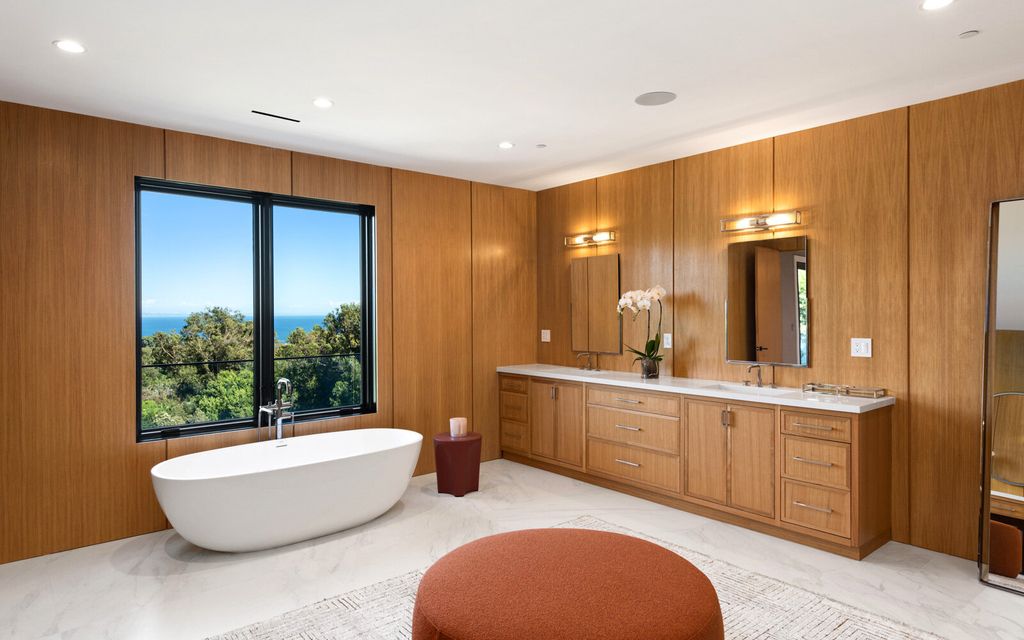 The Home in Malibu, a majestic estate Bbuilt on a palatial scale, with soaring ceilings, stunning woodwork, and bespoke fixtures, the residence has been entirely remodeled inside and out with impeccable attention to detail is now available for sale. This home located at 7052 Dume Dr, Malibu, California