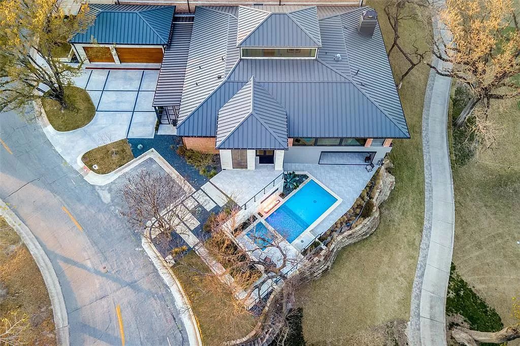 17214 Club Hill Drive, Dallas, Texas is a modern masterpiece perfectly situated with pristine views of both the Bent Tree & Preston Trail Golf courses along with its picturesque view of White Rock Creek.