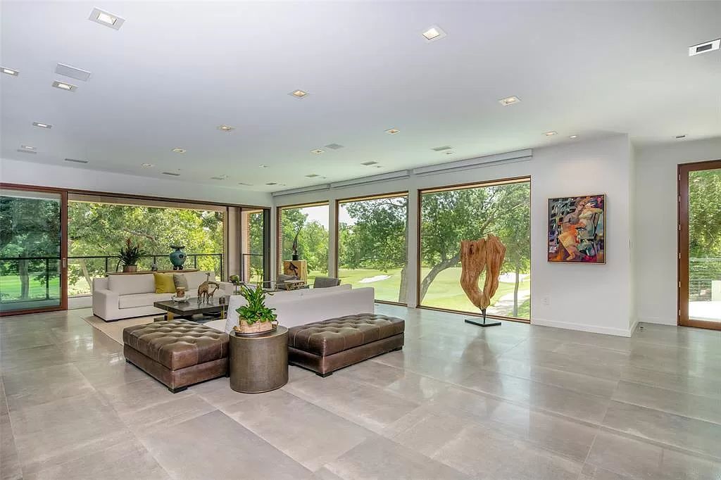 17214 Club Hill Drive, Dallas, Texas is a modern masterpiece perfectly situated with pristine views of both the Bent Tree & Preston Trail Golf courses along with its picturesque view of White Rock Creek.