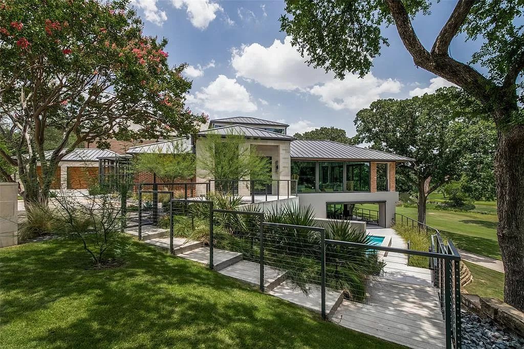 17214 Club Hill Drive, Dallas, Texas is a modern masterpiece perfectly situated with pristine views of both the Bent Tree & Preston Trail Golf courses along with its picturesque view of White Rock Creek.