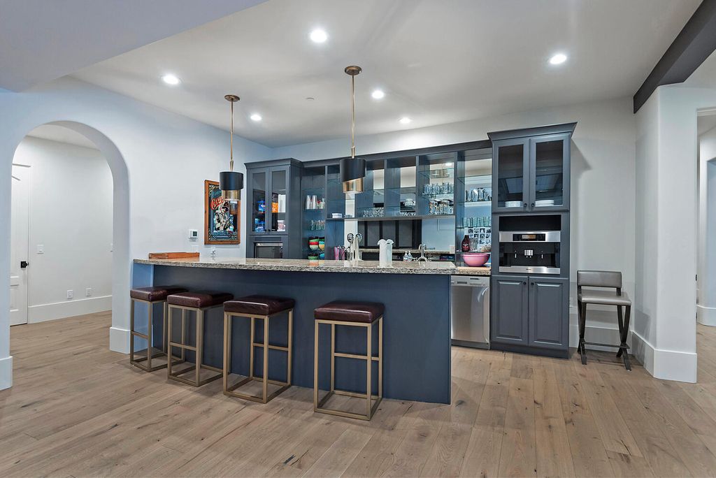 The Estate in Sandy is a luxurious home that has undergone a throughout extensive remodel now available for sale. This home located at 3271 E Deer Hollow Dr S, Sandy, Utah; offering 05 bedrooms and 11 bathrooms with 12,931 square feet of living spaces.