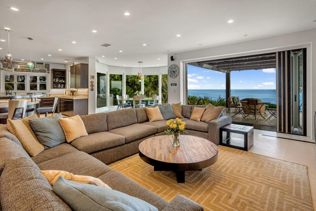 The Estate in Malibu, an exceptional property on the bluffs of the world-renowned Paradise Cove Beach offers destination resort-style living with a gorgeous infinity pool, a tennis court, outdoor barbeque and pizza oven and more is now available for sale. This home located at 28060 Sea Lane Dr, Malibu, California