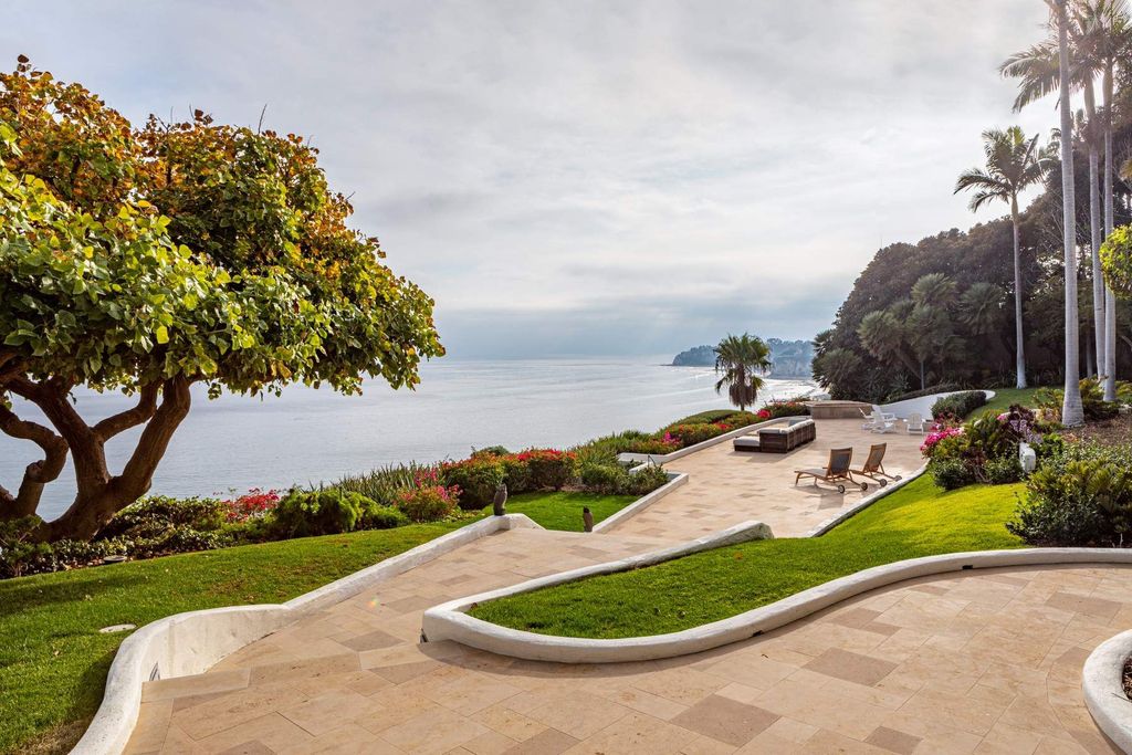 The Estate in Malibu, an exceptional property on the bluffs of the world-renowned Paradise Cove Beach offers destination resort-style living with a gorgeous infinity pool, a tennis court, outdoor barbeque and pizza oven and more is now available for sale. This home located at 28060 Sea Lane Dr, Malibu, California