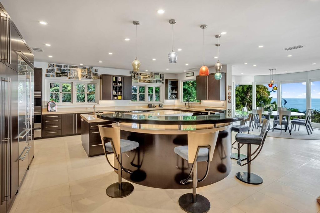 The Estate in Malibu, an exceptional property on the bluffs of the world-renowned Paradise Cove Beach offers destination resort-style living with a gorgeous infinity pool, a tennis court, outdoor barbeque and pizza oven and more is now available for sale. This home located at 28060 Sea Lane Dr, Malibu, California