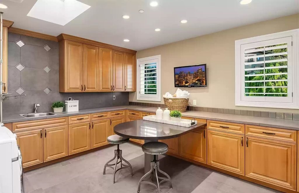 The Estate in Bellevue is a luxurious home built to entertain with a movie theatre, great room, wine cellar, recreation room, and a full bar now available for sale. This home located at 1044 89th Avenue NE, Bellevue, Washington; offering 05 bedrooms and 07 bathrooms with 6,054 square feet of living spaces.