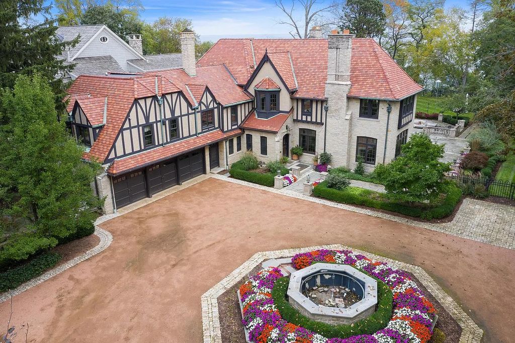 The Mansion in Shorewood offers beautiful backyard with outdoor granite Kit, pergola dining area and Firepit, now available for sale. This home located at 4496 North Lake Dr, Shorewood, Wisconsin
