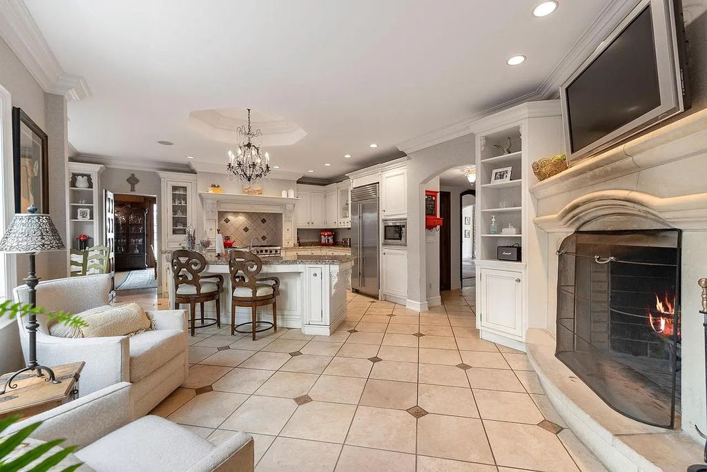 The Mansion in Shorewood offers beautiful backyard with outdoor granite Kit, pergola dining area and Firepit, now available for sale. This home located at 4496 North Lake Dr, Shorewood, Wisconsin