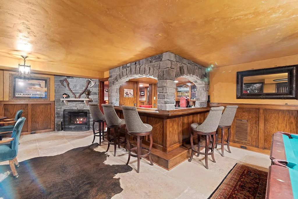 The Mansion in Shorewood offers beautiful backyard with outdoor granite Kit, pergola dining area and Firepit, now available for sale. This home located at 4496 North Lake Dr, Shorewood, Wisconsin